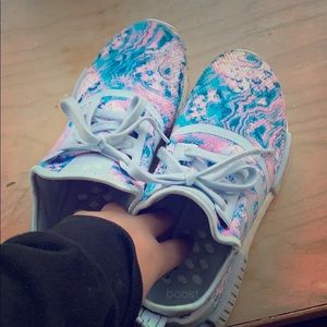 This is a pare of adidas shoes .